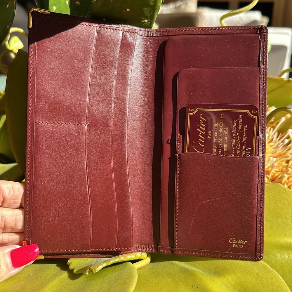 CARTIER PARIS, burgundy long wallet 1988. GUC  full inclusion. Box, duster COA